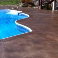 pool-decks-spellbinding-acid-stain-concrete-pool-deck-with-brown-stain-concrete-pool-for-vinyl-liner-pool-designs-also-stainless-steel-swimming-pool-handrails-600x206